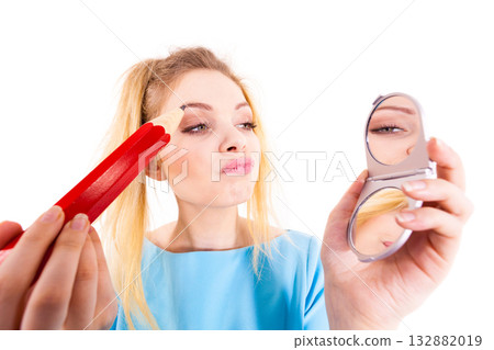 Woman painting eyebrows using regular pencil Woman painting eyebrows using regular pencil 132882019