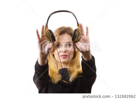 Teenage woman wearing headphones 132882062