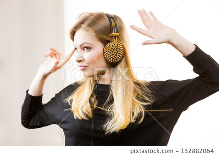 Teenage woman wearing headphones 132882064