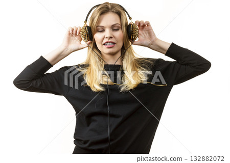 Teenage woman wearing headphones 132882072