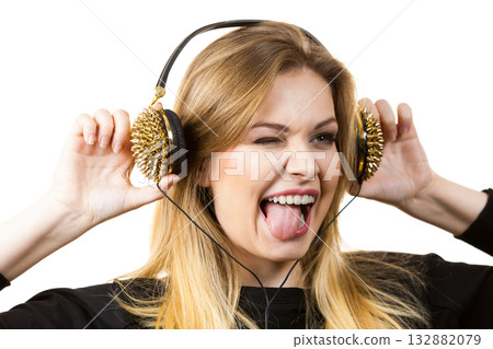 Teenage woman wearing headphones Teenage woman wearing headphones 132882079