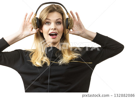 Suprised woman wearing headphones 132882086