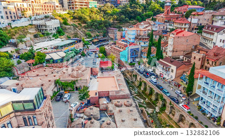 Aerial vIEW ON OLD TOWN AND Kura river of TBILISI IN SUNSET fROM AbaNOTUBANI Aerial vIEW ON OLD TOWN AND Kura river of TBILISI IN SUNSET fROM AbaNOTUBANI 132882106