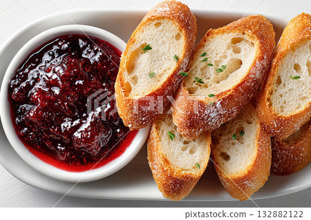 Stylish tableware. Hotel breakfast. Rustic farmhouse breakfast with homemade jam and fresh baked bread. Top view. 132882122