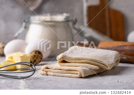 Raw puff pastry dough with baking ingredient Raw puff pastry dough with baking ingredient 132882414
