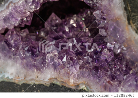 Amethyst Crystal Druse macro mineral on white background Amethyst Crystal Druse macro mineral on white background 132882465