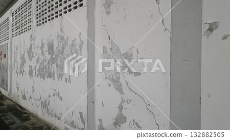 Peeling paint cracked wall concrete texture weathered surface urban decay damp stain rough plaster aged facade. Peeling paint Peeling paint cracked wall concrete texture weathered surface urban decay damp stain rough plaster aged facade. Peeling paint 132882505