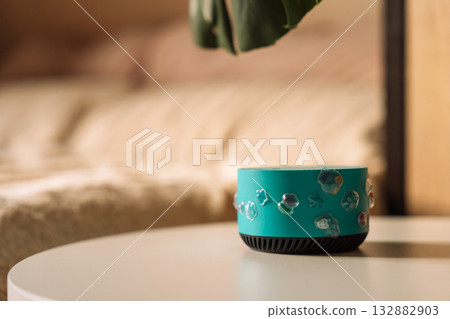 Kids AI assistant speaker decorated with stickers in cozy bedroom 132882903