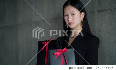 Stylish retail concept with dark fashion tones and bold color accents, perfect for advertising, seasonal campaigns, and Black Friday promotions Stylish retail concept with dark fashion tones and bold color accents, perfect for advertising, seasonal campaigns, and Black Friday promotions 132883396