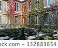 Autumnal courtyard of the Carnavalet Museum, which specializes in the history of Paris, located in the 3rd arrondissement of Paris, the French capital. 132883854