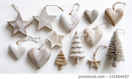 Scandinavian wooden Christmas ornaments shaped as stars and trees, isolated on white background with rustic charm. 132884087