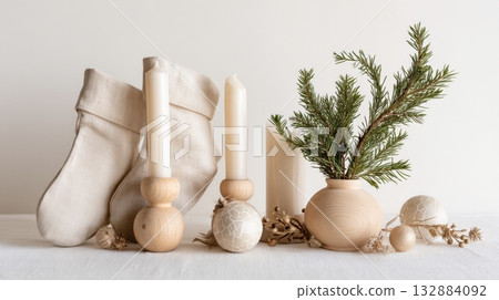 Minimalist Christmas ornaments styled in Scandinavian design, isolated on white background with natural textures and warm seasonal charm. 132884092