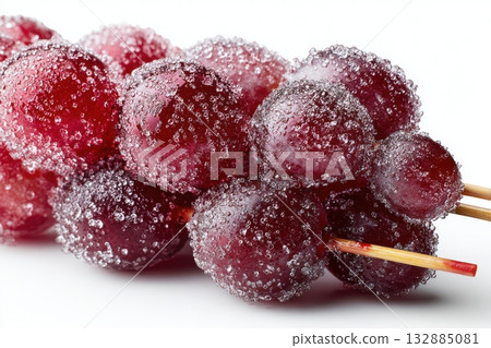 Glossy grape tanghulu skewers coated in crystallized sugar glaze, isolated on white for cultural and food projects. 132885081
