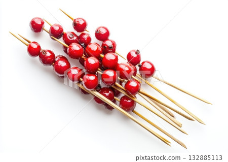 Tanghulu Skewers with Candied Hawthorn Berries Isolated on White Background for Minimalist Food Photography Tanghulu Skewers with Candied Hawthorn Berries Isolated on White Background for Minimalist Food Photography 132885113