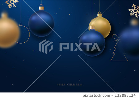 Elegant blue and gold ornaments hang against deep backdrop, evok Elegant blue and gold ornaments hang against deep backdrop, evok 132885124
