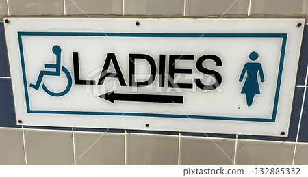 Women's and wheelchair accessible restroom sign 132885332