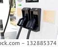 An electric vehicle charging station in an outdoor parking lot. An eco-friendly transport concept. 132885374