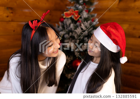 Two friends are sharing a joyful moment during the Christmas season 132885591