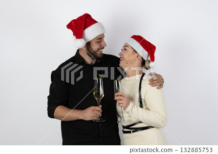 A couple is joyfully decorating a Christmas tree together 132885753