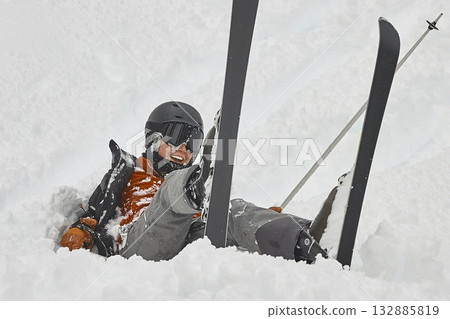 Skiing in the winter woman fallen over 132885819