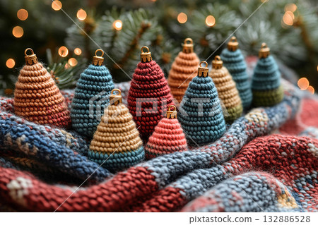 Craft influencer vibe. Handcraft. Crocheted bright Christmas trees on a winter background. Christmas atmosphere. Creative hobby. 132886528