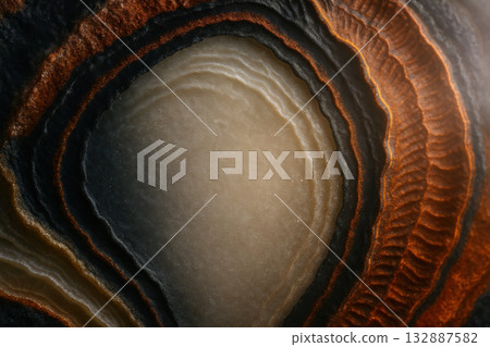 Colorful geological patterns showing layers of agate stone with smooth textures and warm tones 132887582