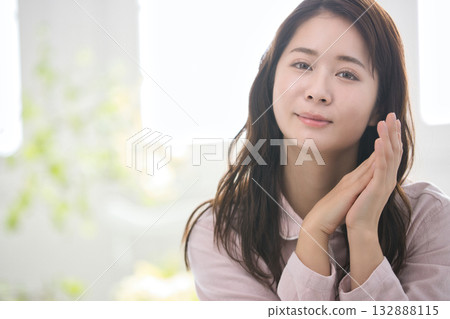 Young woman relaxing in pajamas Young woman relaxing in pajamas 132888115