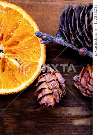 Christmas photo with dried oranges and pine cones Christmas photo with dried oranges and pine cones 132888255
