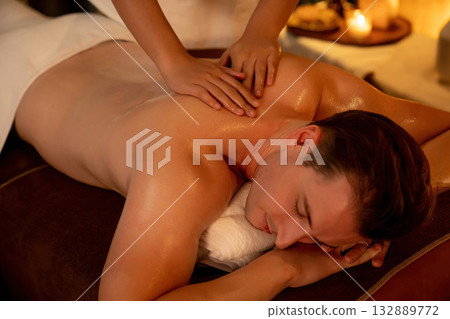 Caucasian man customer enjoying relaxing anti-stress massage. Quiescent 132889772