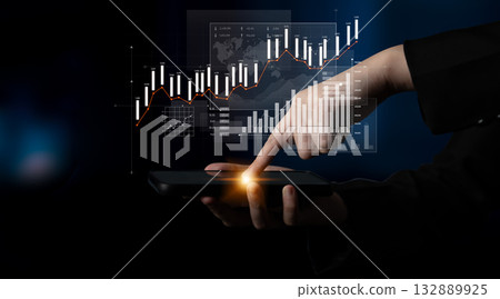 Hand using smartphone to analyze financial data with charts and graphs displaying stock market trends and performance in a modern digital environment Scalp 132889925