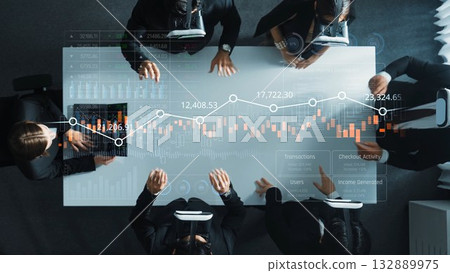 Diverse Group Engaged in Financial Analysis with Data Visualization on Glass Table, Business Insights and Technology in Modern Office Setting. Raster 132889975