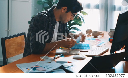 Smart designer helping manager choosing color from color palettes. Symposium. Smart designer helping manager choosing color from color palettes. Symposium. 132889977