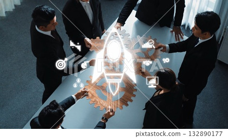 Team Collaboration on Business Strategy with Innovative Rocket Symbol Above Table in Modern Office Environment. Raster Team Collaboration on Business Strategy with Innovative Rocket Symbol Above Table in Modern Office Environment. Raster 132890177