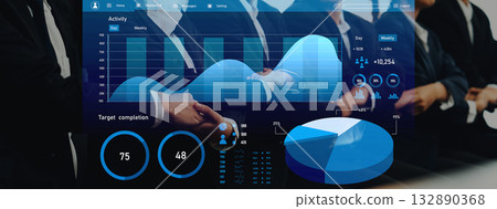 Professional Business Presentation with Data Visualization Graphics in Conference Room Focusing on Teamwork, Strategy, and Performance Metrics Axiom 132890368