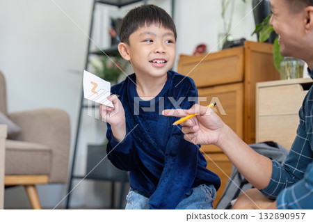 Father and Son Learning Fun. Exciting moments with educational flashcards. Father and Son Learning Fun. Exciting moments with educational flashcards. 132890957