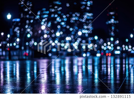 Nocturnal cityscape with intense blue bokeh lights reflecting on a wet urban street 132891115