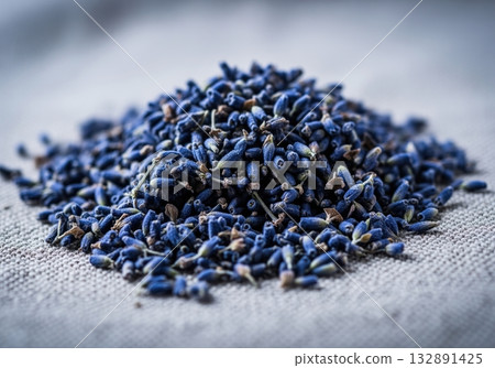 Dense heap of dried indigo lavender buds for aromatherapy and natural medicine. 132891425