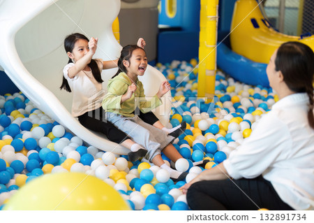 Children Sliding Down in Fun Ball Pit Playground 132891734