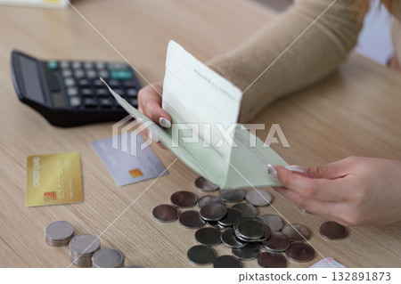 Financial Management. Woman organizing her coins and credit cards at home. Financial Management. Woman organizing her coins and credit cards at home. 132891873