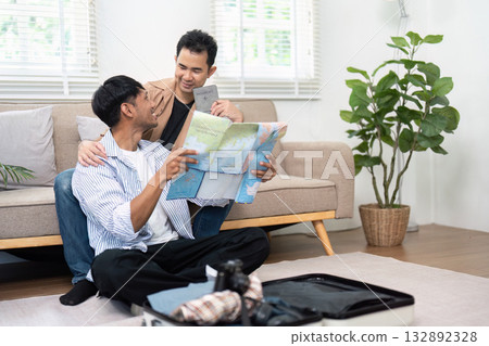 Travel Planning and Exploration. A couple reviewing a map and discussing their travel plans. Travel Planning and Exploration. A couple reviewing a map and discussing their travel plans. 132892328