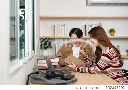 Collaborative Learning Environment. Two students discussing project ideas in modern workspace. 132892392
