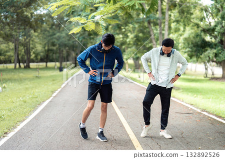 Father and Son Stretching Together on a Wellness Journey 132892526