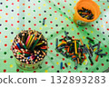 Colored pencils in a large jar on the table 132893283