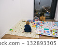 Child playing in children's room among toys 132893305