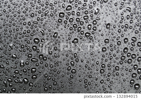 Water droplets on black cover background. Suitable for design and wallpaper. Water droplets on black cover background. Suitable for design and wallpaper. 132894015