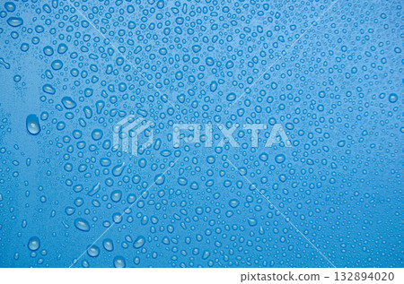 Water droplets on ocean blue cover background. Suitable for design and wallpaper. 132894020