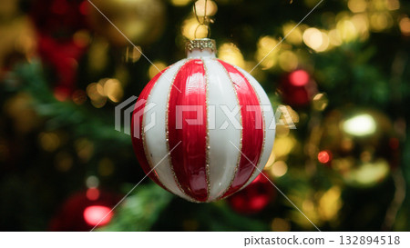 Christmas ball with flashing lights from the tree Christmas ball with flashing lights from the tree 132894518
