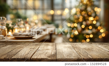 blank wooden table with blurred Christmas tree and festive dinner background blank wooden table with blurred Christmas tree and festive dinner background 132894528