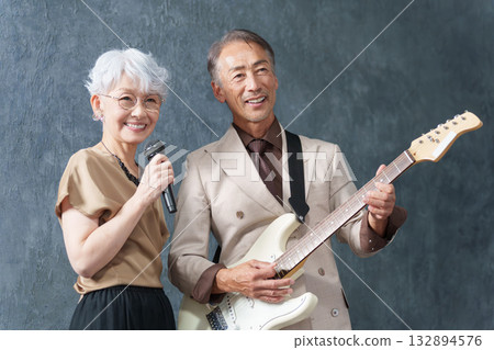 Senior men and women forming a rock band Senior men and women forming a rock band 132894576