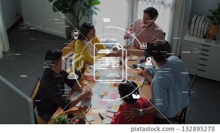 Team Collaboration in Modern Office Setting with Digital Interface Elements Overlaid on Group Brainstorming Session Around Conference Table. Raster Team Collaboration in Modern Office Setting with Digital Interface Elements Overlaid on Group Brainstorming Session Around Conference Table. Raster 132895278